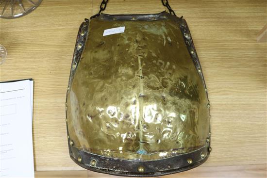 A pair of Victorian brass and iron armour chest plates